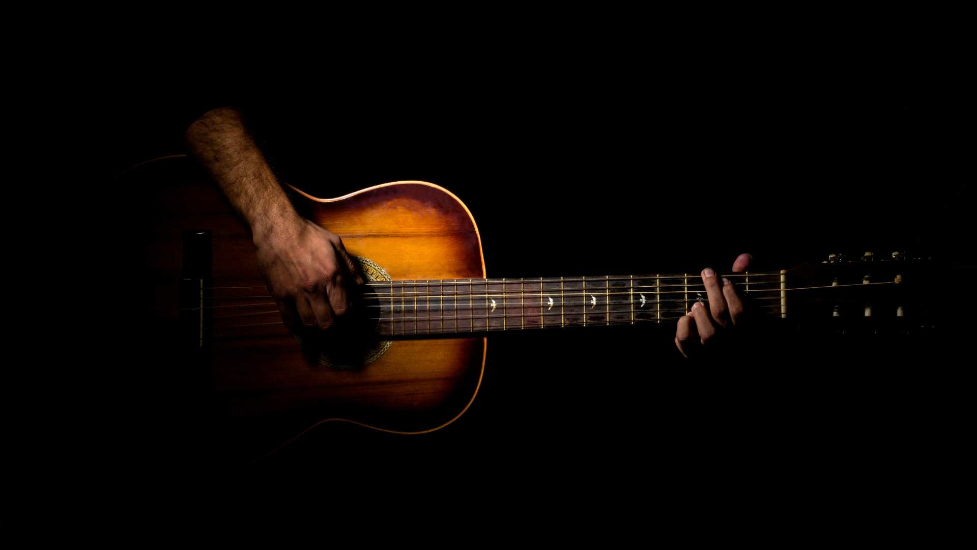 men who playing guitar