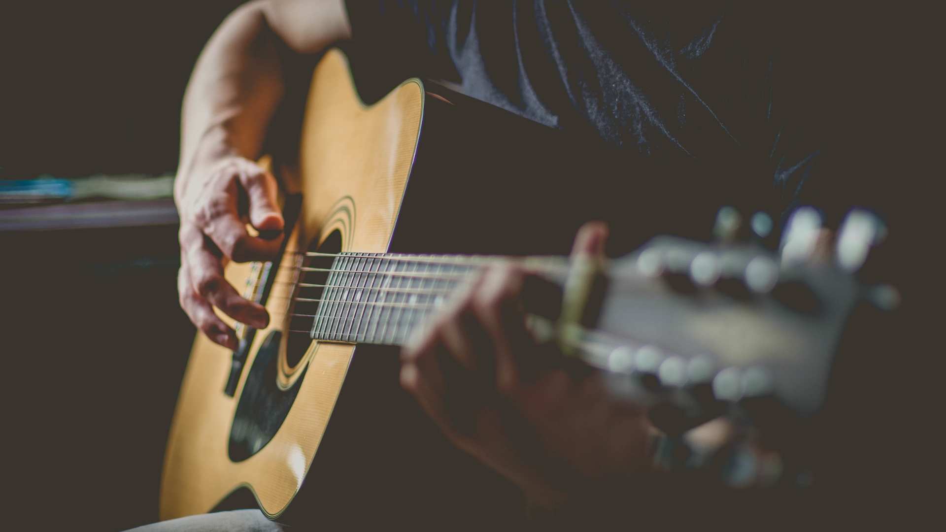 men who playing guitar